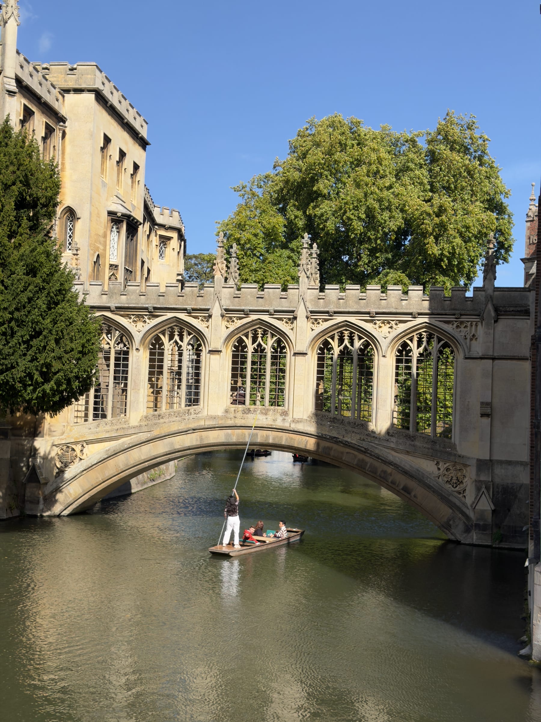 Sunlit stone arches of the Bridge of Sighs above the River Cam, Cambridge